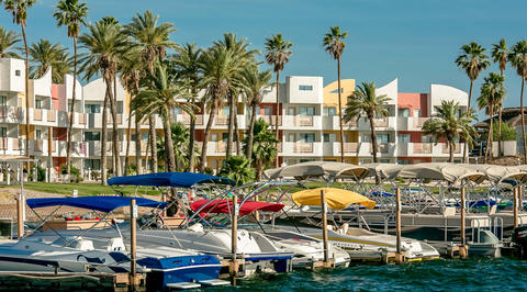 Yacht marina located in front of colorful buildings